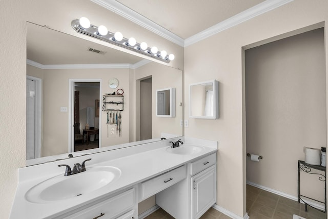 bathroom with ornamental molding, tile patterned floors, and vanity