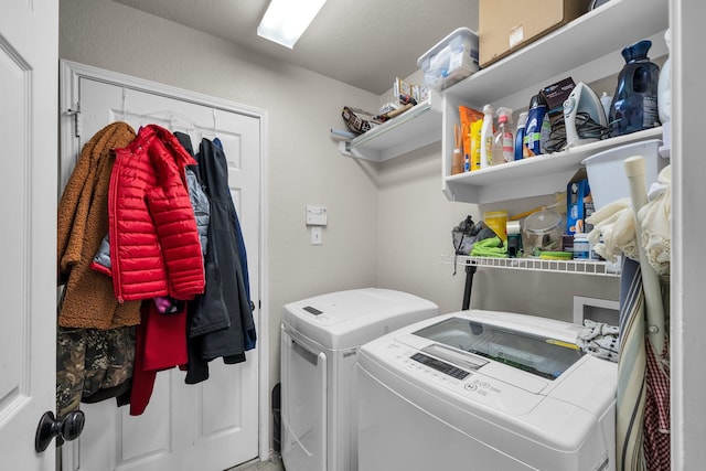 laundry room featuring washing machine and clothes dryer