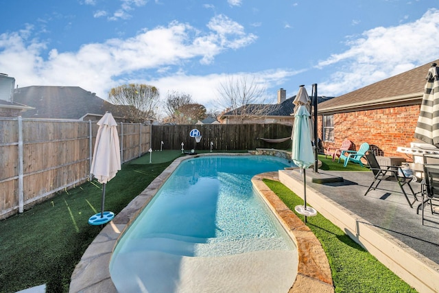 view of swimming pool with a patio area