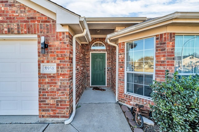 property entrance with a garage