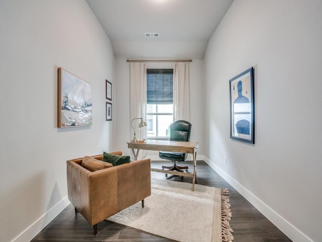 home office featuring dark wood-type flooring and lofted ceiling