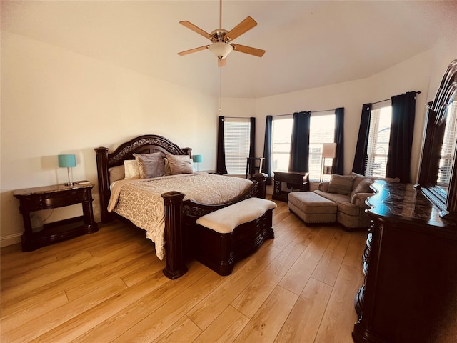 bedroom with ceiling fan and light hardwood / wood-style flooring