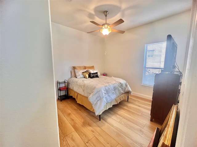 bedroom featuring ceiling fan and light wood-type flooring