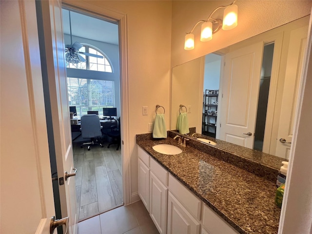 bathroom with vanity and hardwood / wood-style floors