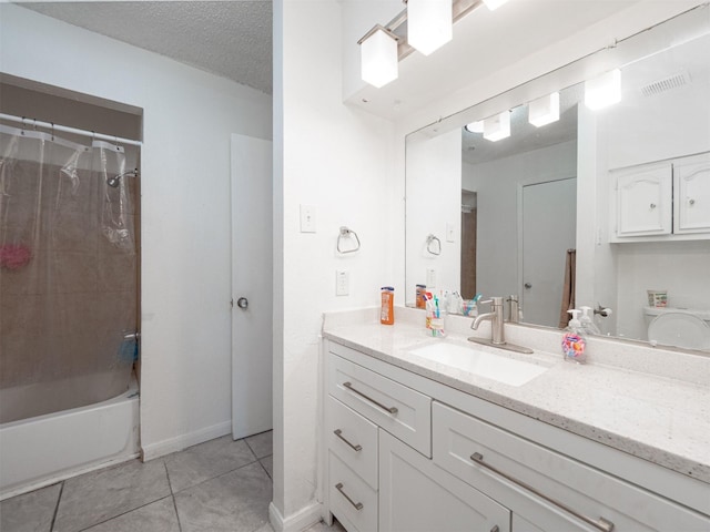 bathroom featuring vanity, tile patterned flooring, a textured ceiling, and shower / bathtub combination with curtain