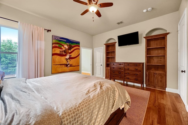 bedroom with ceiling fan and hardwood / wood-style floors