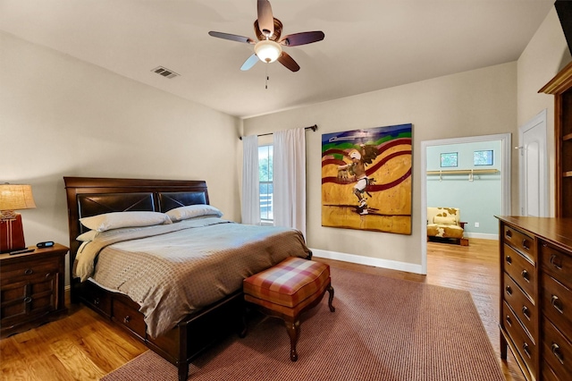 bedroom with ceiling fan and light wood-type flooring