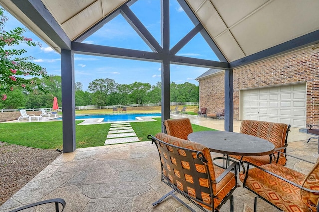 view of patio featuring a fenced in pool