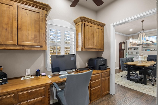 home office with ceiling fan with notable chandelier, dark hardwood / wood-style flooring, and ornamental molding