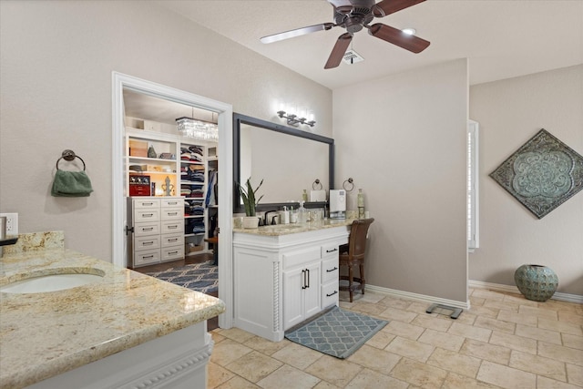 bathroom with ceiling fan and vanity