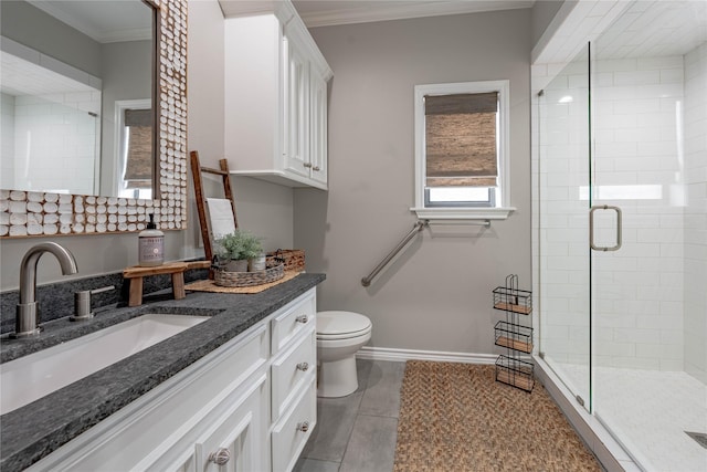 bathroom featuring an enclosed shower, vanity, tile patterned flooring, and ornamental molding