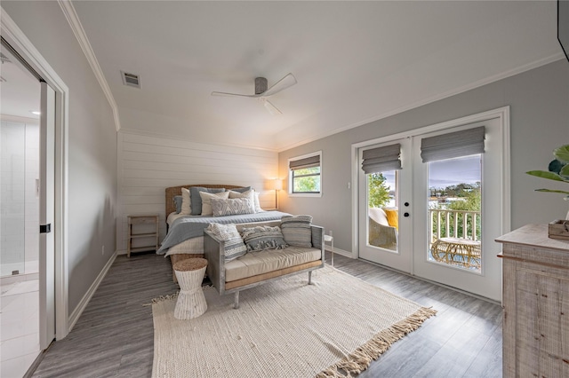 bedroom featuring ceiling fan, ensuite bath, hardwood / wood-style flooring, and access to outside