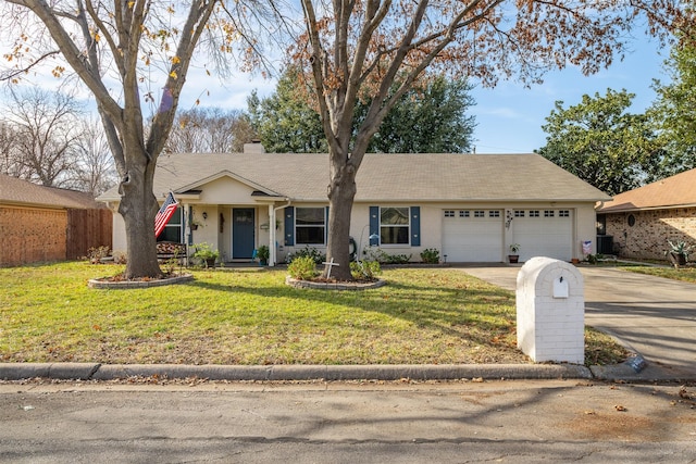 ranch-style house featuring a front yard and a garage