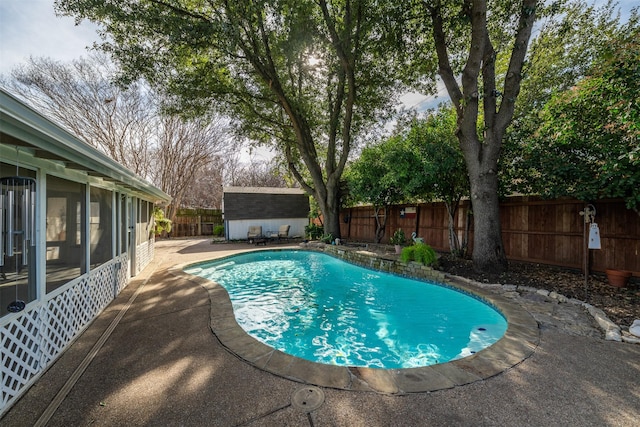 view of swimming pool featuring a patio area