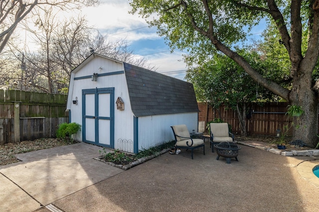 view of outdoor structure with an outdoor fire pit