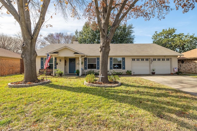 single story home featuring a front lawn and a garage