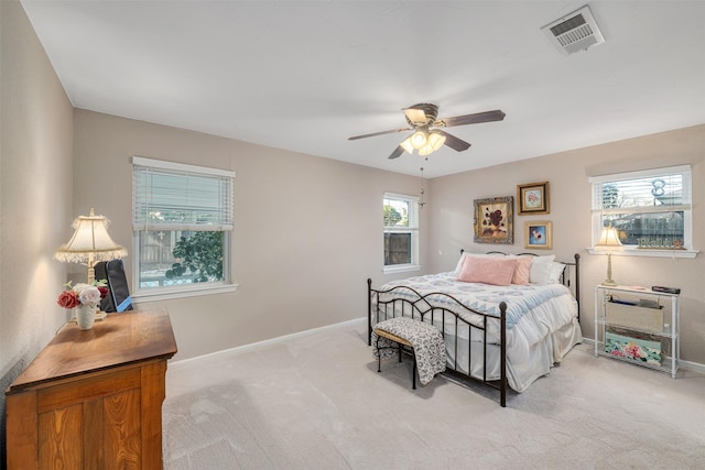 bedroom featuring ceiling fan and light colored carpet