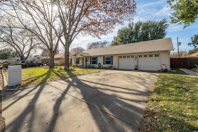 single story home featuring a front yard and a garage