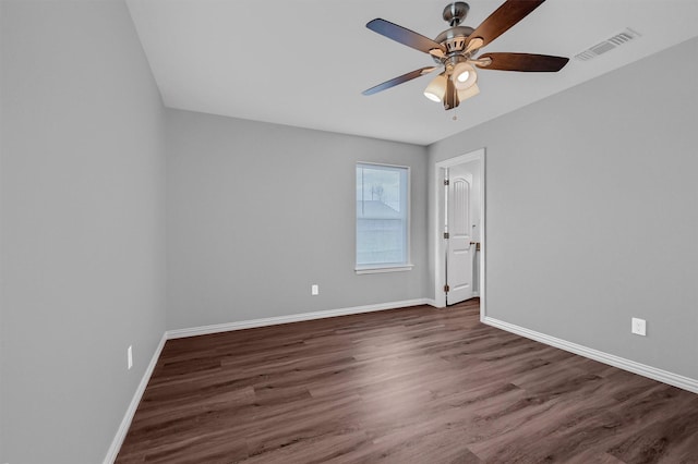 unfurnished room featuring ceiling fan and dark hardwood / wood-style floors