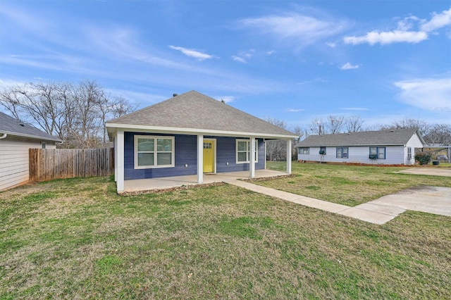 view of front of home with a front lawn and a patio