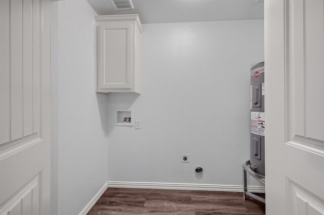 clothes washing area with washer hookup, cabinets, dark hardwood / wood-style floors, and hookup for an electric dryer