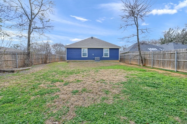 rear view of house with a lawn