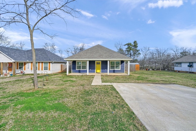 ranch-style home with a front yard and a porch