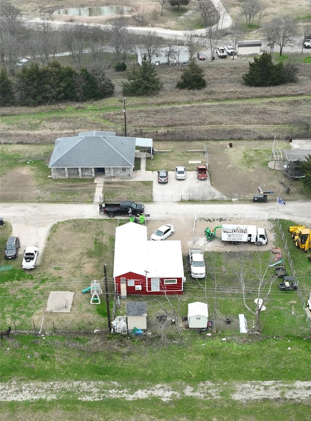 birds eye view of property featuring a rural view