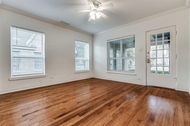 empty room with hardwood / wood-style flooring, ceiling fan, crown molding, and plenty of natural light