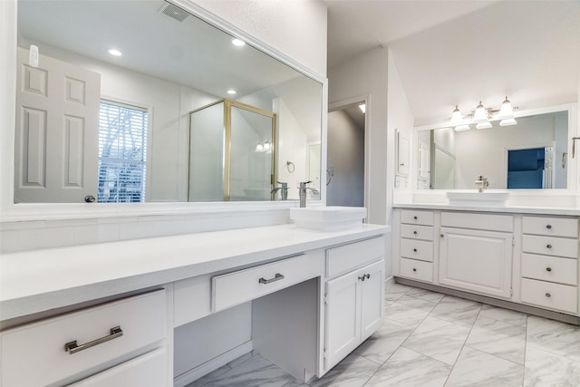 bathroom with a shower with shower door and vanity