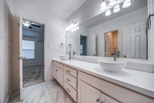 bathroom with ceiling fan and vanity