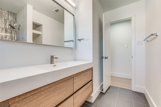 bathroom featuring tile patterned floors and vanity