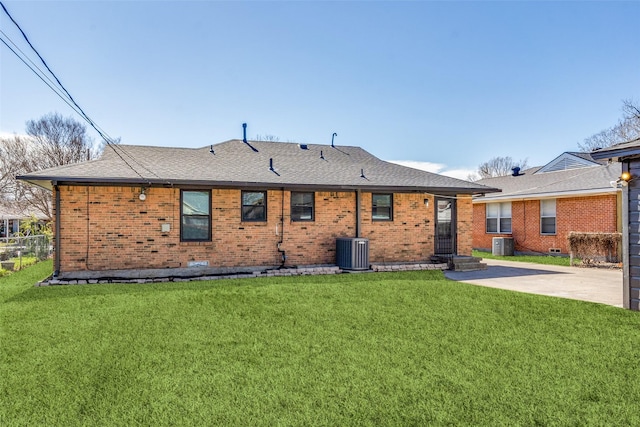 back of house featuring a patio area, cooling unit, and a yard