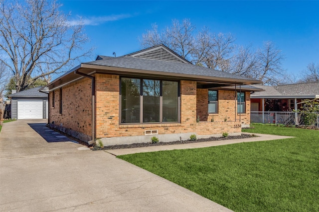 view of property exterior featuring a garage, an outbuilding, and a lawn