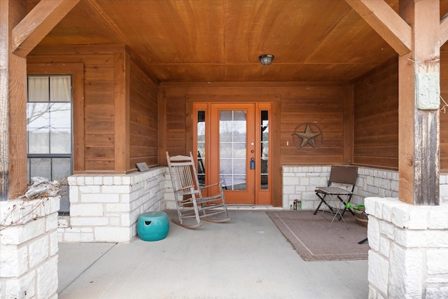 entrance to property featuring a porch