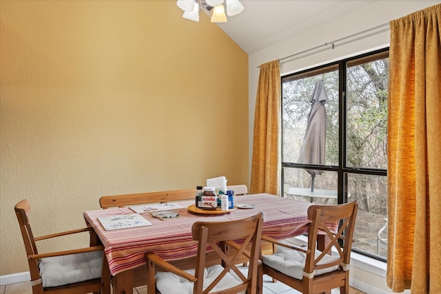 dining room with lofted ceiling