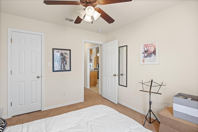 bedroom with ceiling fan and light colored carpet