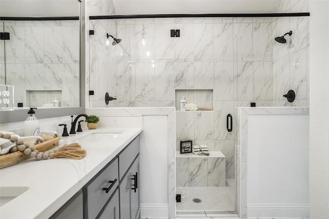 bathroom featuring vanity and an enclosed shower