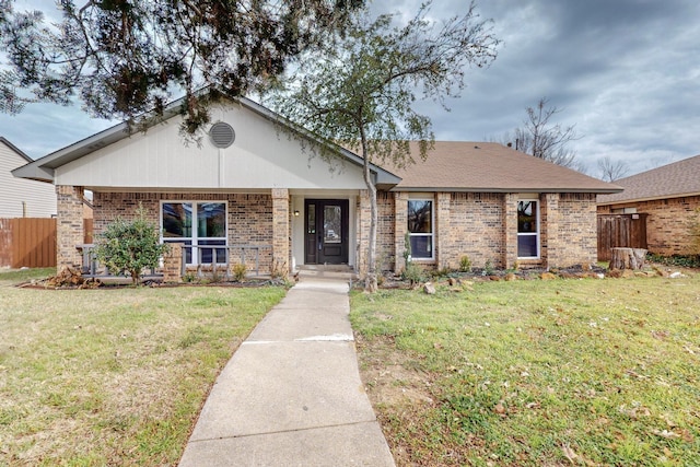 ranch-style home featuring a front yard