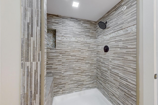 bathroom featuring tiled shower