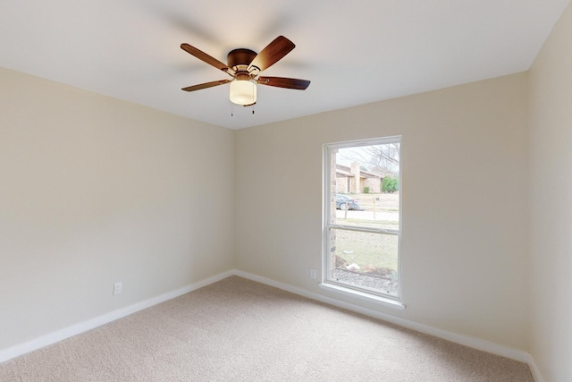 empty room featuring ceiling fan and carpet flooring