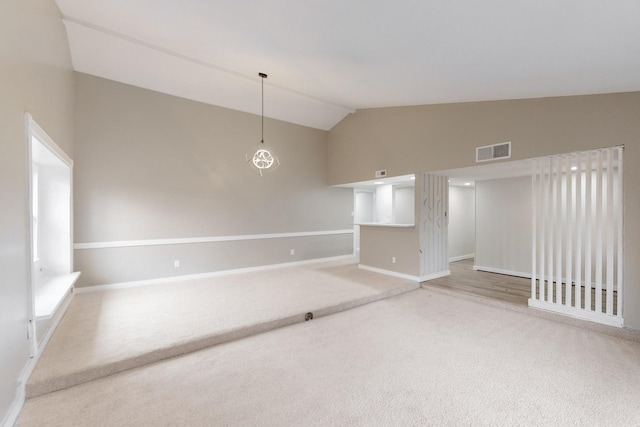 unfurnished room featuring high vaulted ceiling and carpet flooring