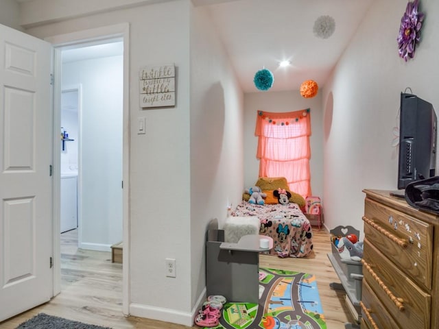 bedroom with hardwood / wood-style floors