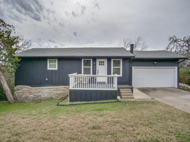 single story home with a garage, a front yard, and a porch