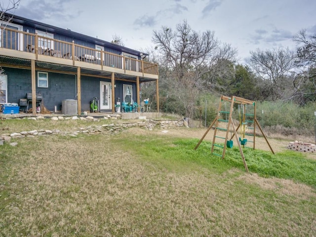 exterior space with central AC unit and a playground