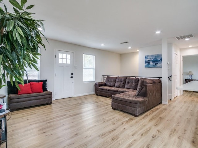 living room with light hardwood / wood-style flooring