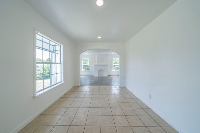 unfurnished room with light tile patterned floors