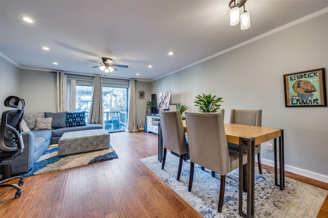 dining room featuring ceiling fan, ornamental molding, and hardwood / wood-style floors