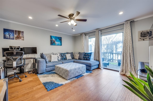 living room with ceiling fan, ornamental molding, and hardwood / wood-style floors