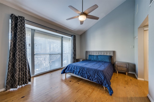 bedroom featuring vaulted ceiling, ceiling fan, and light hardwood / wood-style flooring